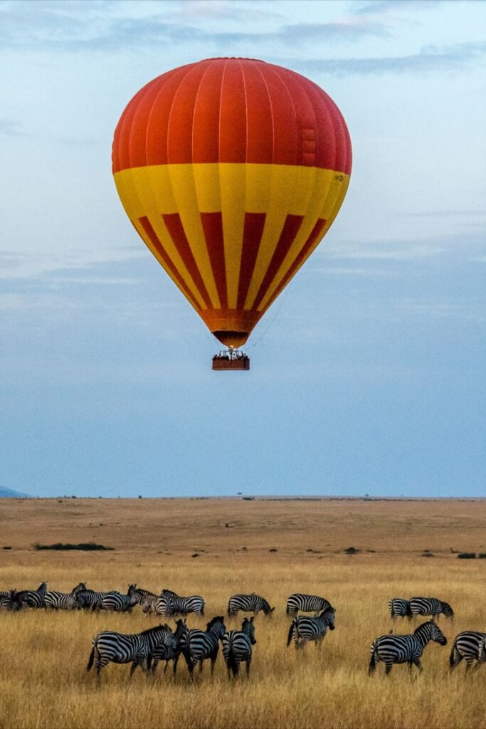 Luxury Maasai Mara hot air balloon tour in Kenya, featuring scenic sunrise views and wildlife photography opportunities for high-end safari packages by roadrave tours and travel